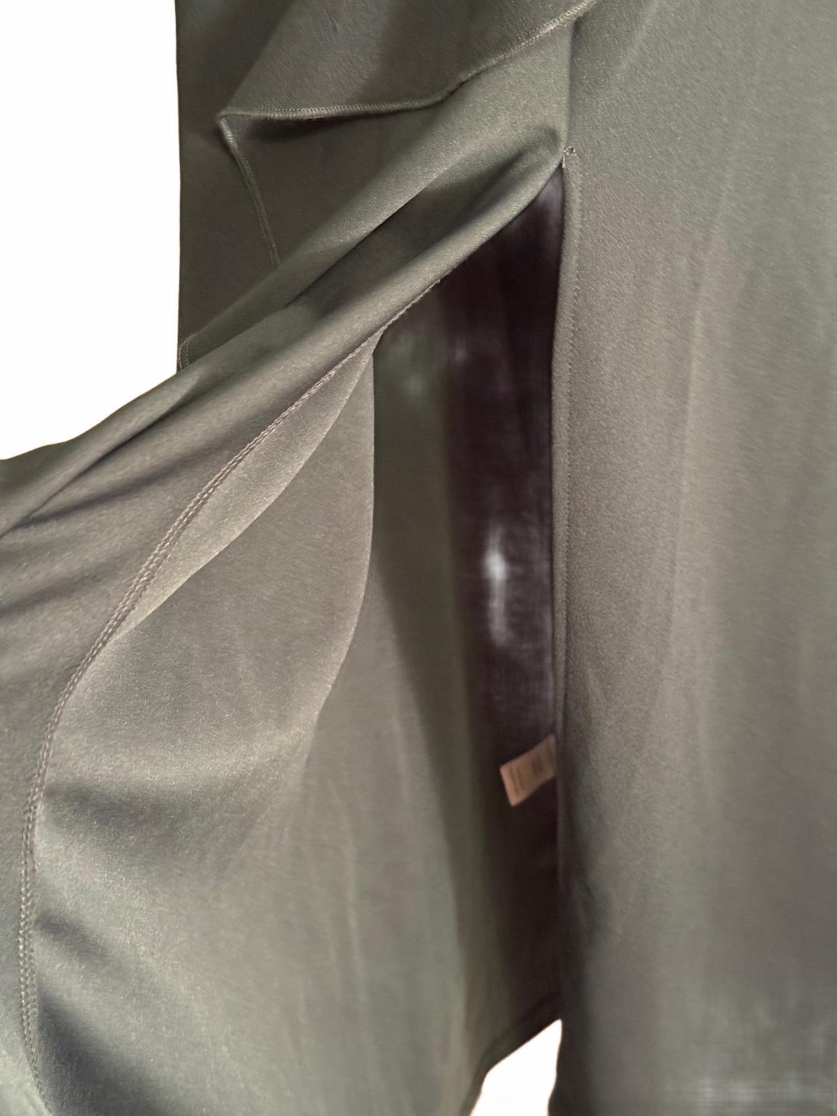 Elegant Sleeveless Dark Green Maxi Dress with Ruffle Detail